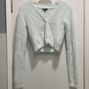 A powder blue sweater and skirt set